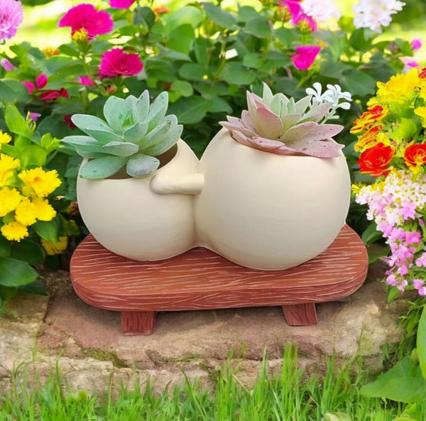 Plant Pot with Pot People sitting together on the bench and reading